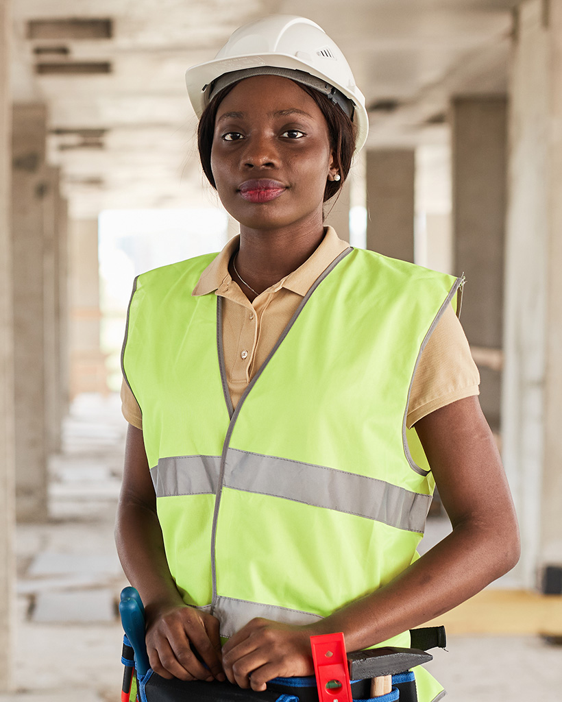 female construction worker smiling FPHBTNR
